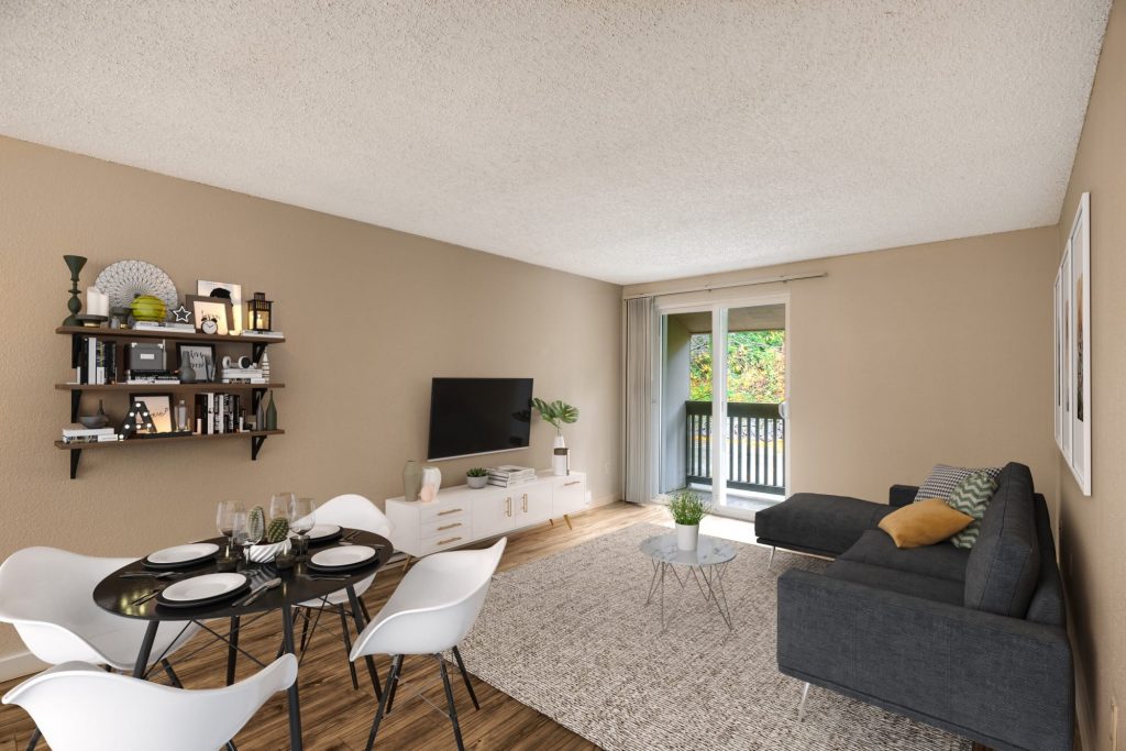 Spacious living room with hardwood-style floors at Karbon Apartments in Newcastle, Washington